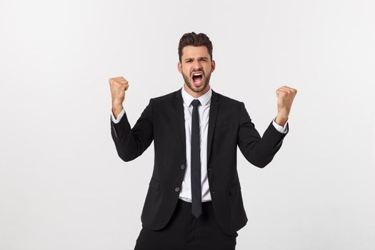 Portrait of a energetic young business man enjoying success, screaming against white - Isolated