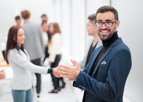 smiling business man standing in the hall of the business center. photo with copy space