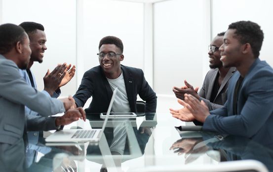 close up. project Manager explaining something to employees at an office meeting