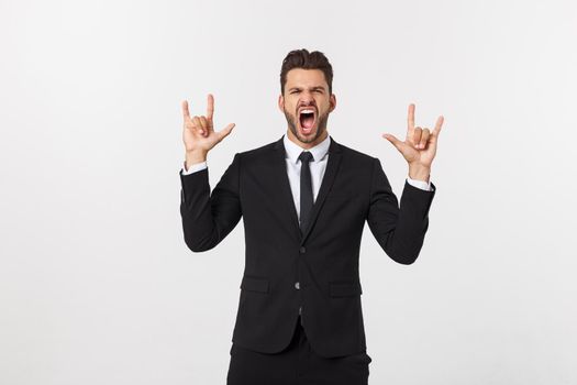Portrait of a energetic young business man enjoying success, screaming against white - Isolated