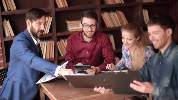businessman discussing with creative business team with new ideas a modern Studio.
