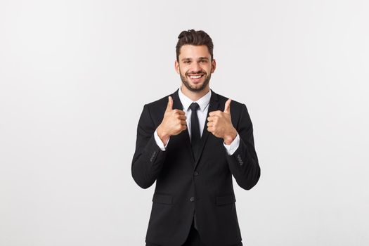 Portrait businessman showing thumbs-up sign on white background.