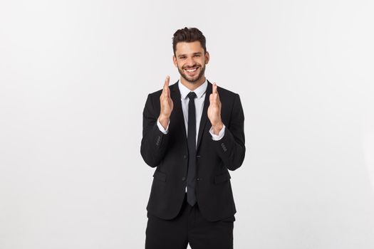 A man shows with his hands a large size on an isolated background.