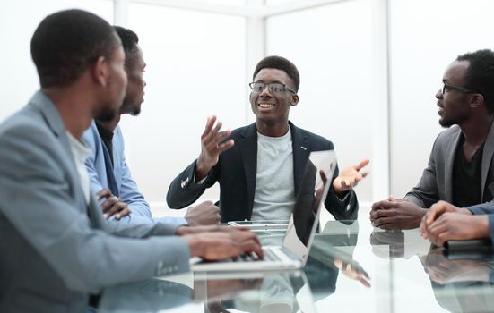 close up. project Manager explaining something to employees at an office meeting