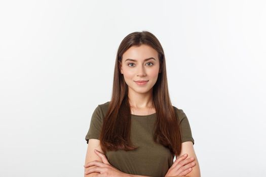 Portrait of a beautiful young woman looking at the camera and smiling, isolated on a white background