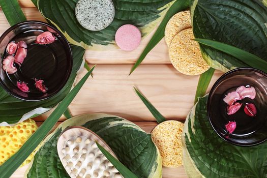 Beautiful Spa Flat Lay with Face and Body Care Cosmetics. Succulent Leaves and Wood Background with Copy Space. Top View Still Life Concept