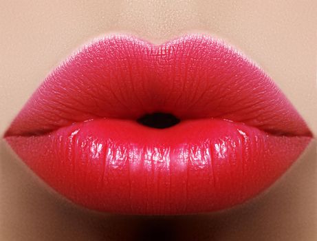 Close-up perfect red lip makeup beautiful female mouth. Plump sexy full lips. Macro photo face detail. Perfect clean skin, fresh lip make-up. Beautiful juicy lips
