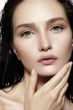 Beautiful Face of young Woman. Skincare, Wellness, Spa. Clean soft Skin, healthy Fresh look. Natural daily makeup, wet hair style