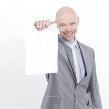 handsome businessman showing blank sheet.isolated on a white background