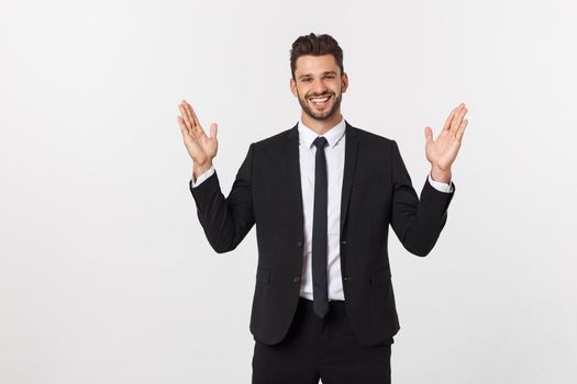 A man shows with his hands a large size on an isolated background.