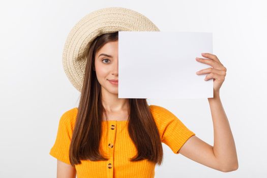 Happy business woman holding big white sign board. Gray wall back.