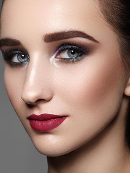 Beautiful Woman with Professional Makeup. Celebrate Style Eye Make-up, Perfect Eyebrows, Shine Skin. Bright Fashion Look.