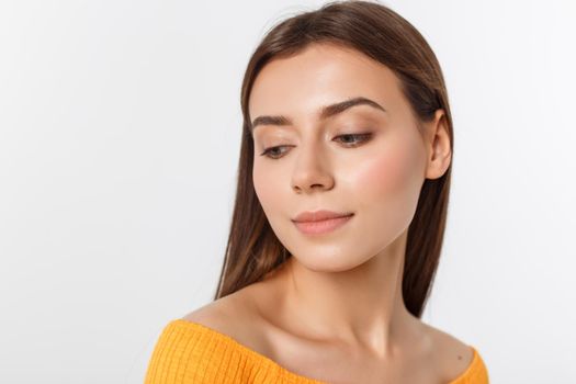 friendly smiling young woman with beatiful face portrait studio shot.