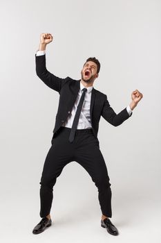 Businessman celebrating success Full Length Portrait isolated on White Background