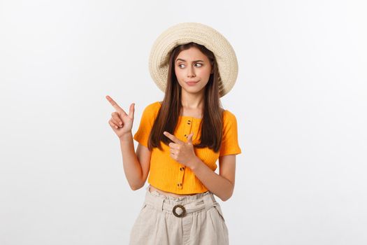 young pretty woman looking unhappy and stressed, suicide gesture making gun sign with hand, pointing to copy space