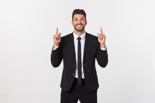 Business Concept: Portrait handsome young businessman point finger on side to empty copy space. Isolated over white background.