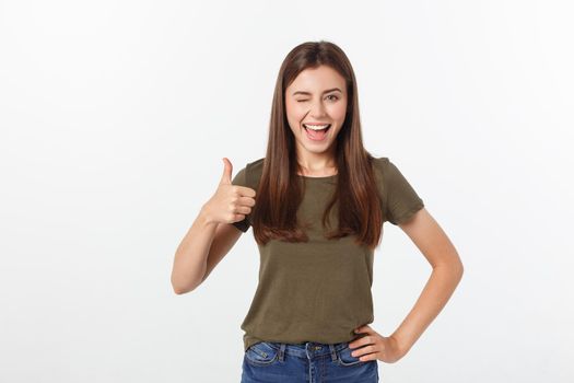 Closeup portrait of a beautiful young woman showing thumbs up sign. Isolate over white background