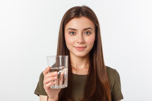 portrait of attractive caucasian smiling woman isolated on white studio shot drinking water