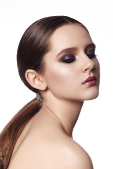 Beautiful Woman with Fashion Makeup. Celebrate Style Smoky Eye Make-up, Shine Skin. Bright Look with Ponytail Hairstyle.