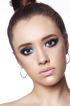 Beautiful Woman with Professional Makeup. Celebrate Style Eye Make-up, Perfect Eyebrows, Shine Skin. Bright Fashion Look.