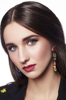 Beautiful Woman with Professional Makeup. Celebrate Style Eye Make-up, Perfect Eyebrows, Shine Skin. Bright Fashion Look.