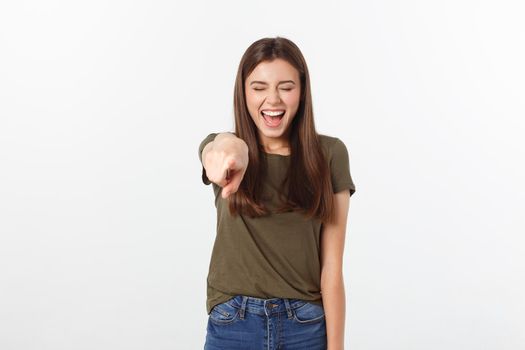 portrait of attractive smile laugh teenage girl, pointing her finger, wear green shirt, white teeth, brown long hair, isolated over white background