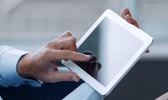 High resolution businessman holding digital tablet