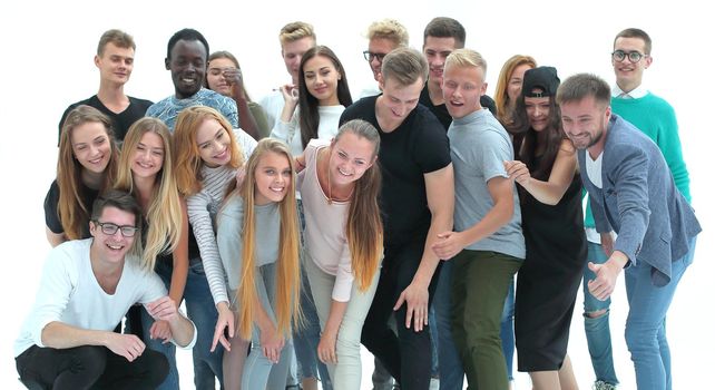 in full growth. group of cheerful young people looking at the camera. isolated on white