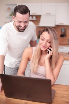 close up. happy married couple chatting with their friends online