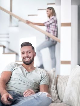 close up. young man sitting on sofa. photo with copy space