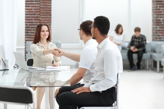 concept of partnership. business and businesswoman shaking hands . photo with copy space