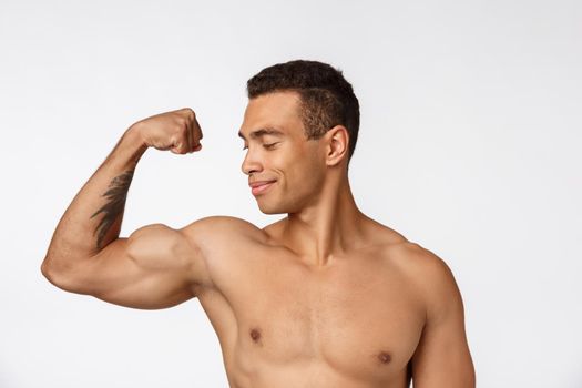 Portrait of a muscular african american man with no shirt. Isolated over white background