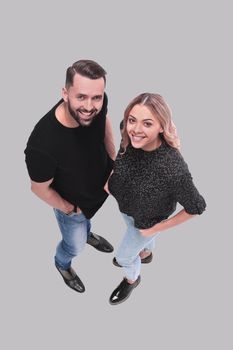 top view. stylish young couple looking at camera . isolated on white background