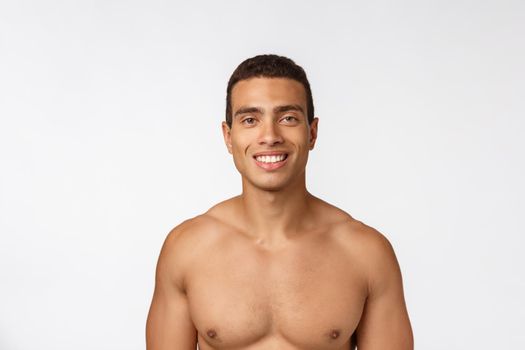 Portrait of a muscular african american man with no shirt. Isolated over white background