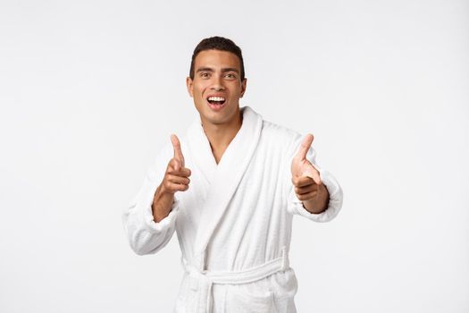 Portrait of happy African American handsome man laughing and showing thumb up gesture