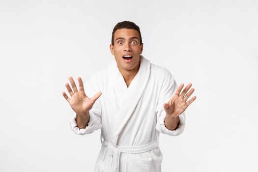 Hurray and cheers. Portrait of handsome shirtless young african american man looking excited while standing against white background.