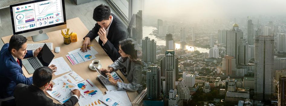 Business people group meeting shot from top widen view in office . Profession businesswomen, businessmen and office workers working in team conference with project planning document on meeting table .