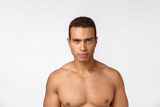 Portrait of a muscular african american man with no shirt. Isolated over white background