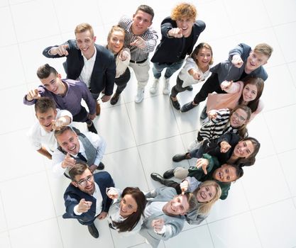 top view. group of young business people standing in a circle. the concept of team building