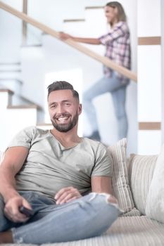 close up. young man sitting on sofa. photo with copy space