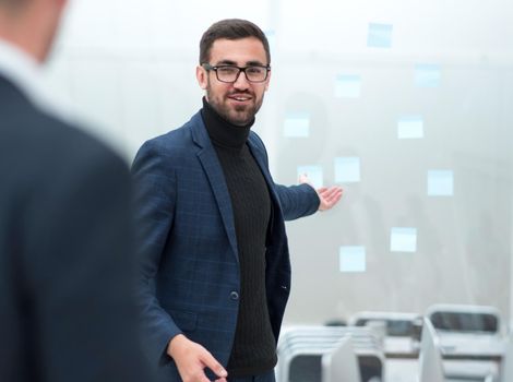 project Manager asks questions during an office meeting. photo with a copy of the space