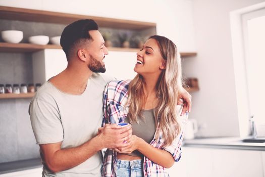 close up. happy young couple in kitchen in good morning time