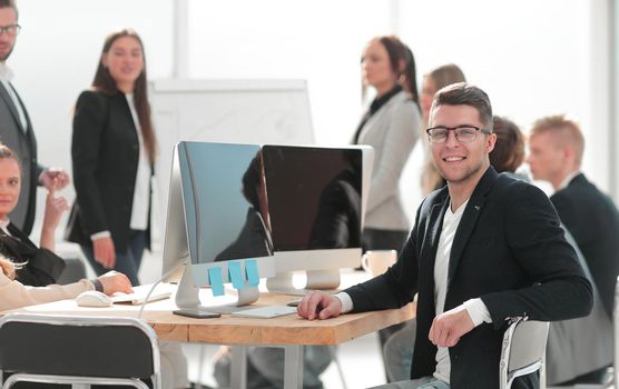 image of a successful business man sitting at his Desk. business background