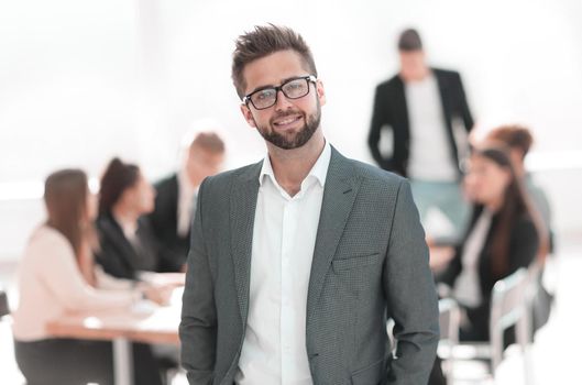 close up. confident businessman standing in his office. business concept