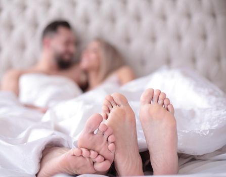 close up.background image of a couple in love lying on the bed