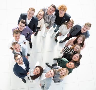 top view. group of young business people standing in a circle. the concept of team building