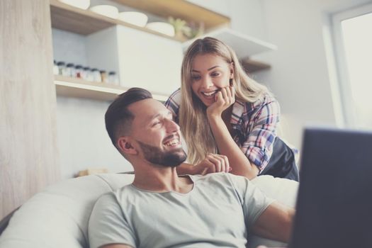 close up. young married couple looking at laptop screen