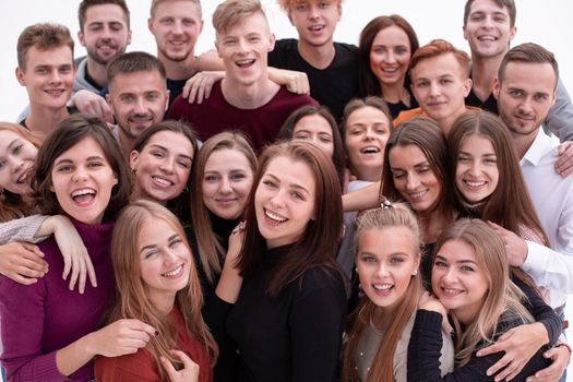 close up. a group of confident young people looking at the camera and showing their success