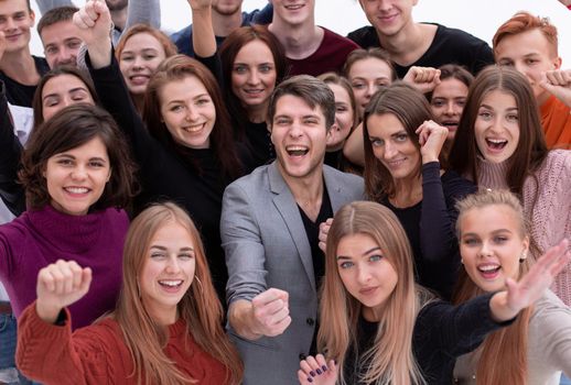 close up. group of happy young people showing their success