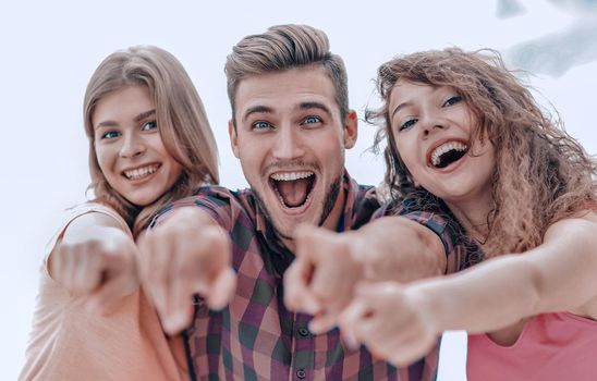 closeup of three happy young people showing hands forward. the concept of perspectives